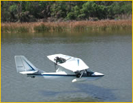 Photo of SeaRey amphibian skimming low over the lake